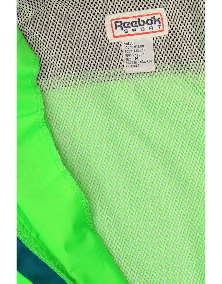 Reebok Regnjakke til mænd UK 38 Medium Grøn Colourblock Nylon