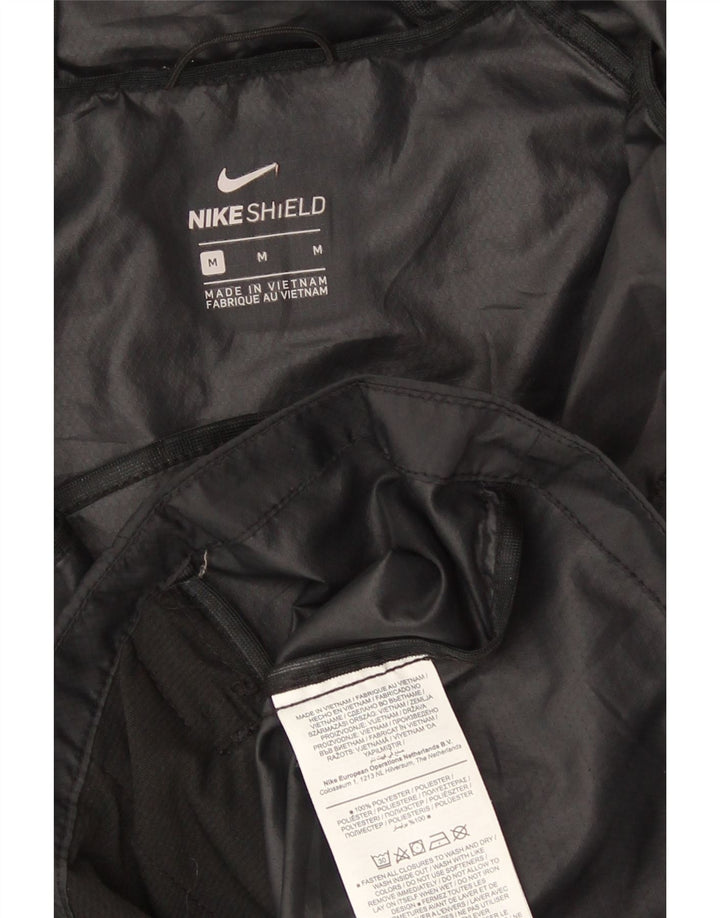 Nike Regnjakke med hætte til kvinder UK 14 Medium Black Polyester Sports