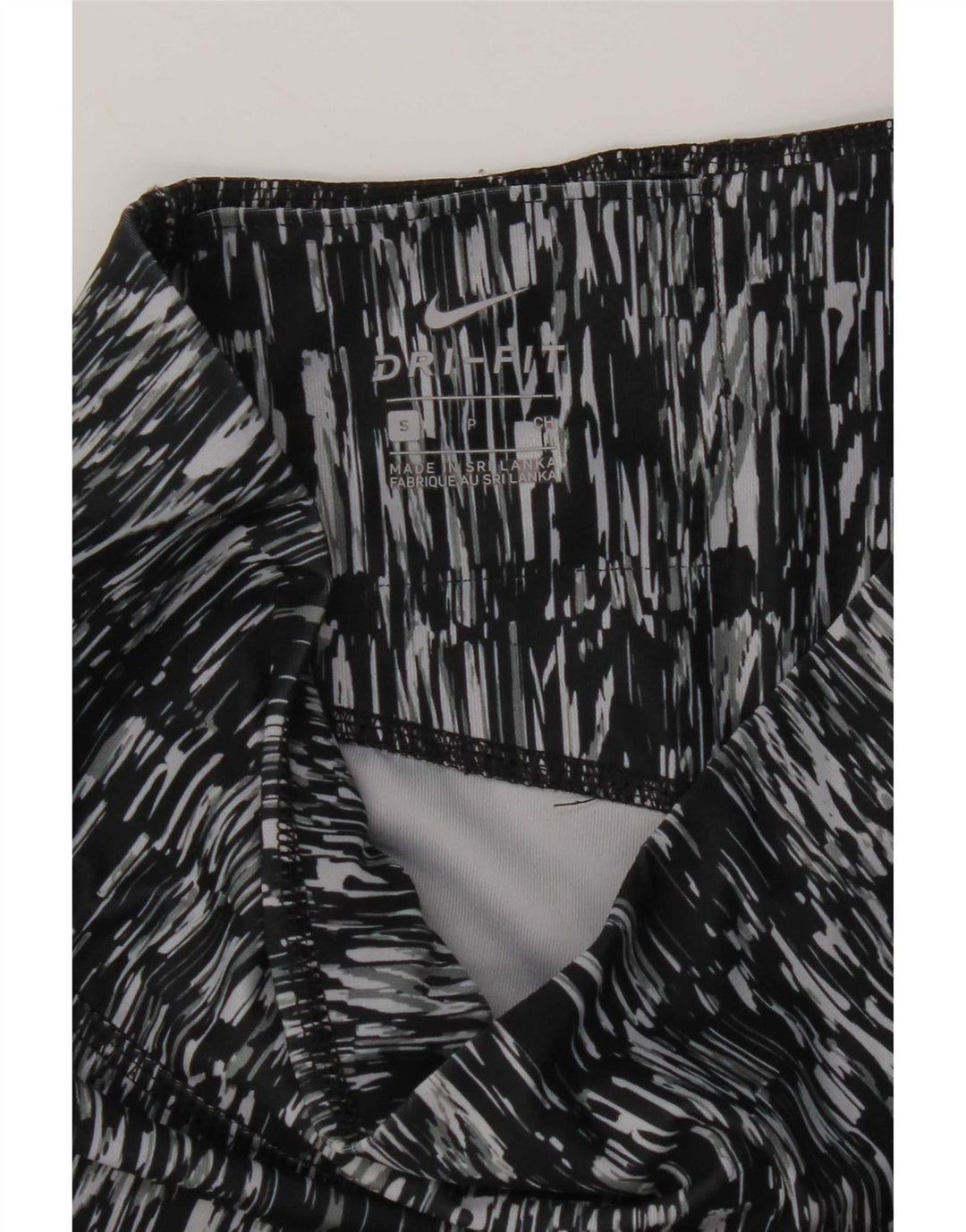 Nike Dame Dri Fit abstrakt mønster Capri Leggings UK 10 Small Black