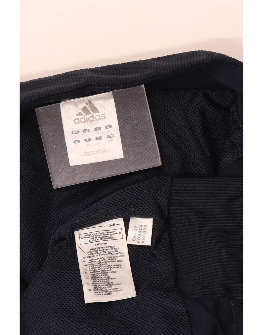 Adidas Grafisk træningsdragt topjakke til mænd Medium Navy Blue Colourblock