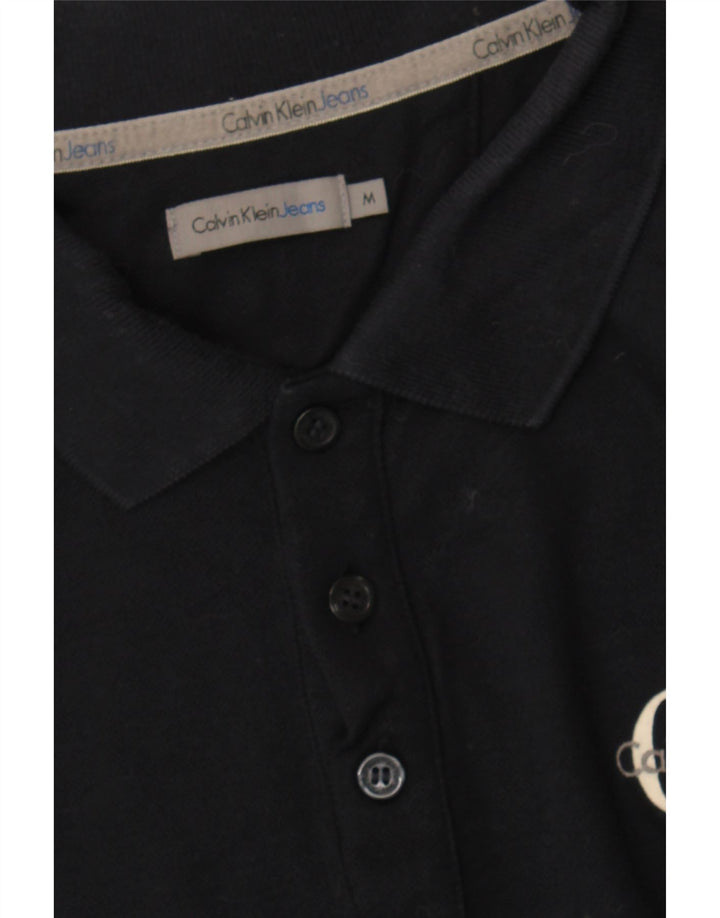 CALVIN KLEIN JEANS Mens Graphic Polo Shirt Medium Navy Blue Cotton Vintage Calvin Klein Jeans and Second-Hand Calvin Klein Jeans from Messina Hembry 