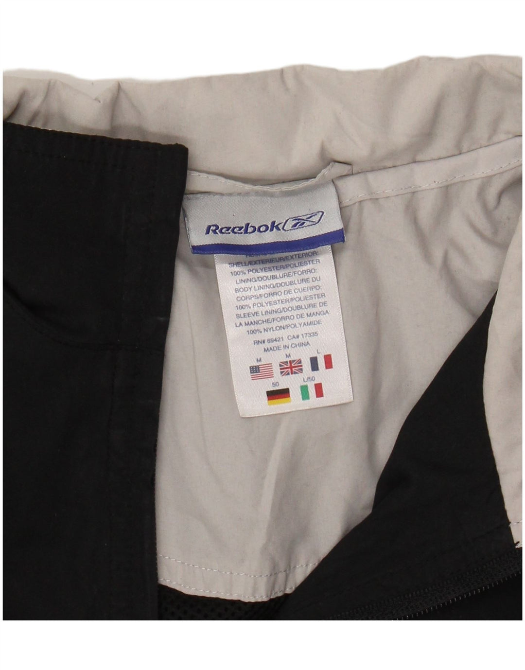 REEBOK Træningsdragt til mænd Topjakke Medium Sort Colourblock Polyester