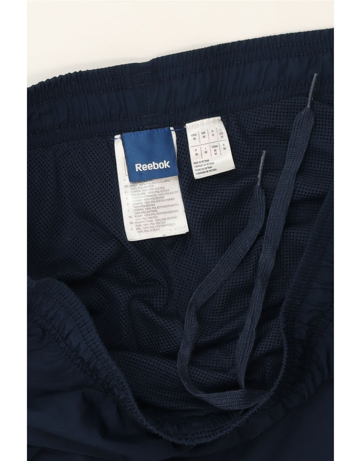 REEBOK Mens Tracksuit Trousers Medium Navy Blue Polyester Vintage Reebok and Second-Hand Reebok from Messina Hembry 