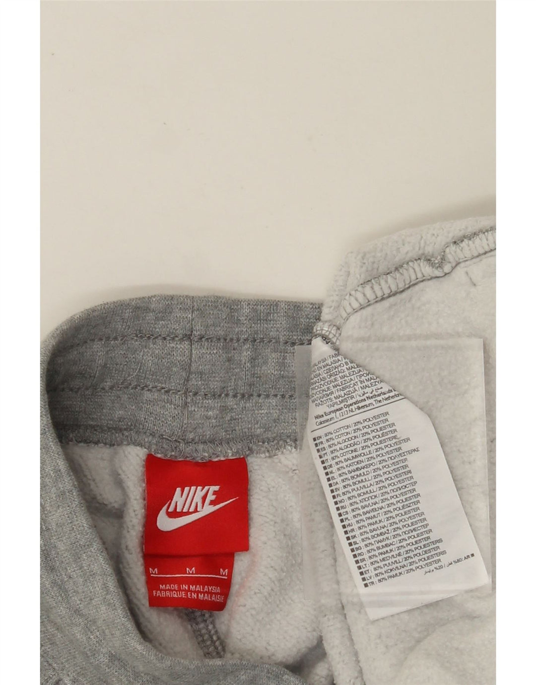 NIKE grafisk træningsdragt bukser til kvinder Joggers UK 14 mellemgrå bomuld