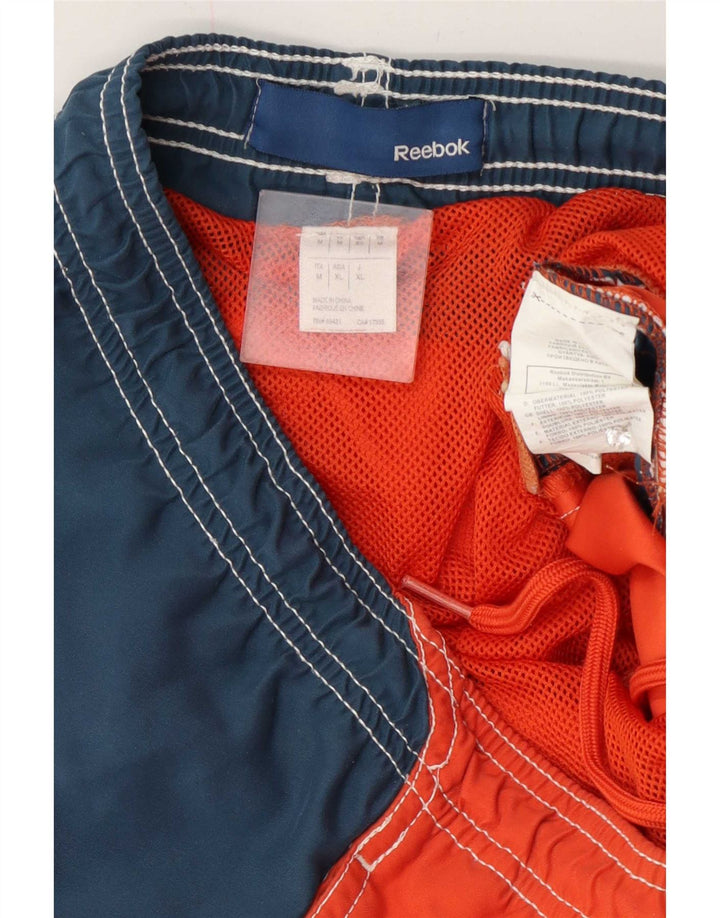 Reebok Herre grafiske svømmeshorts Medium Orange Colourblock Polyester