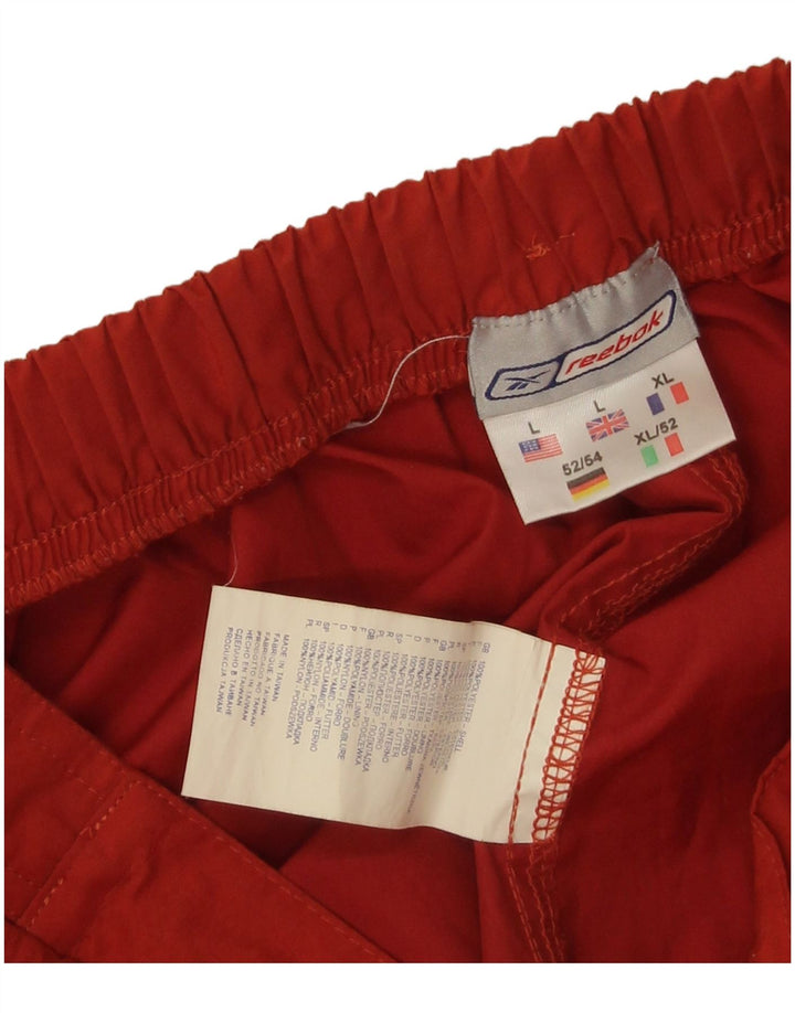 Reebok Træningsdragtsbukser til mænd Stor orange polyester