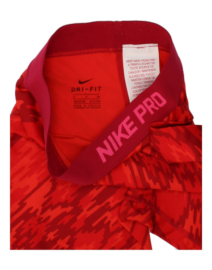 NIKE Girls Dri Fit Capri Leggings 8-9 Years Small Red Camouflage Polyester Vintage Nike and Second-Hand Nike from Messina Hembry 