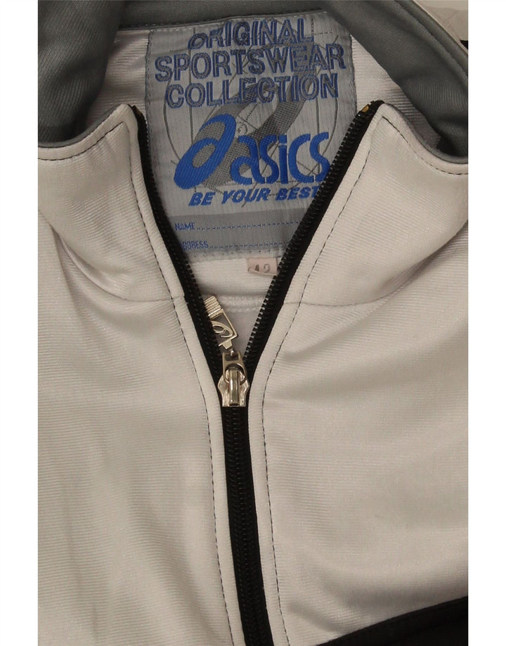 Asics Grafisk træningsdragt topjakke til kvinder IT 42 Medium Sort Colourblock