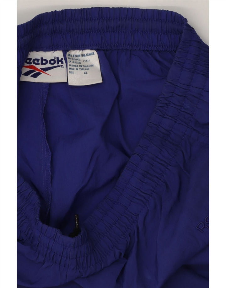 REEBOK Træningsdragt til mænd Joggers XL Lilla Polyester