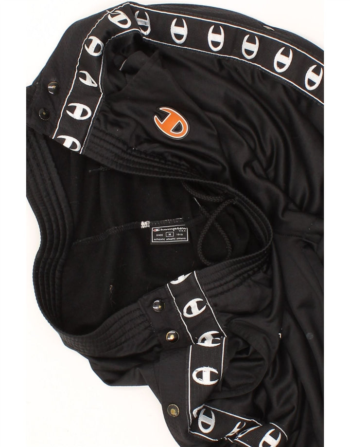 CHAMPION Mens Graphic Tracksuit Trousers Medium  Black Polyester Vintage Champion and Second-Hand Champion from Messina Hembry 