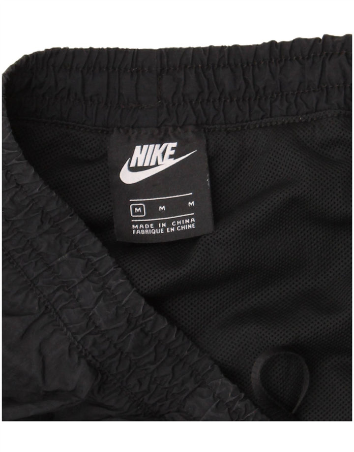 Nike træningsdragtsbukser til kvinder UK 12 Medium Sort