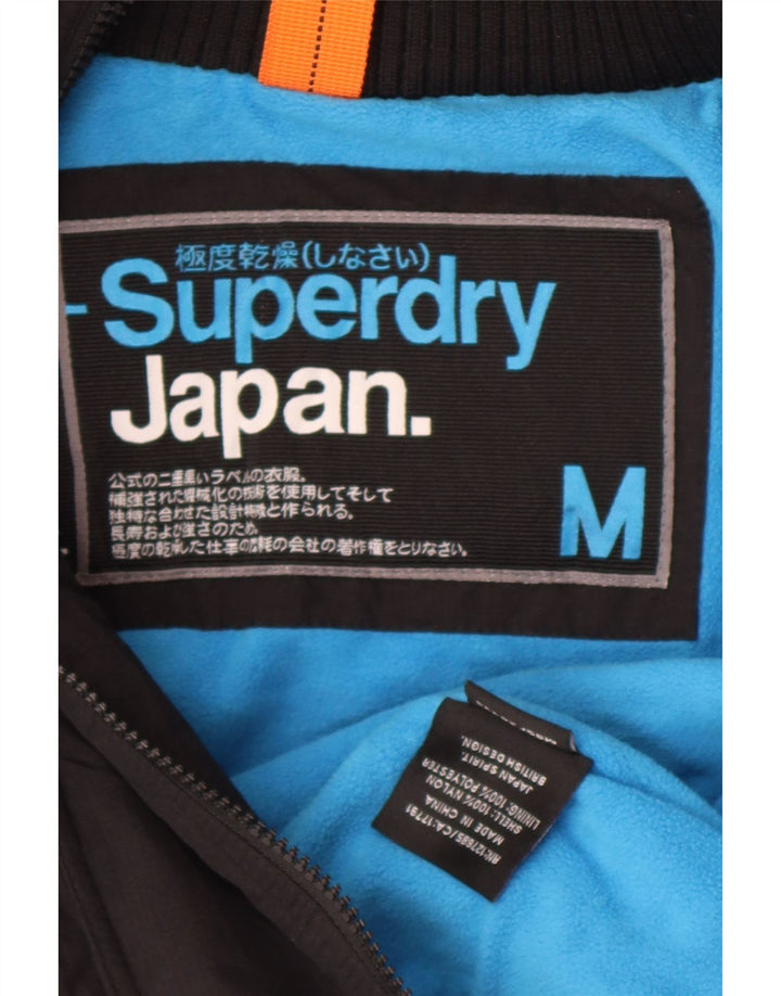 Superdry vindjakkejakke med hætte til kvinder UK 14 Medium Sort Nylon