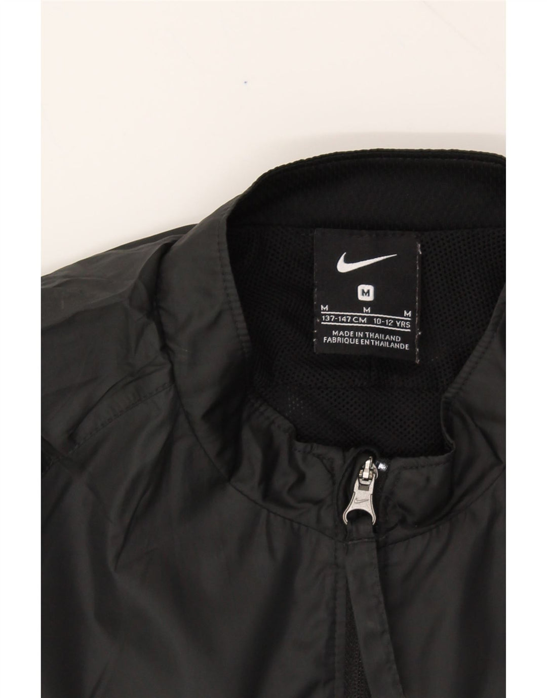 NIKE Boys Tracksuit Top Jacket 10-11 Years Medium Black Polyester Vintage Nike and Second-Hand Nike from Messina Hembry 