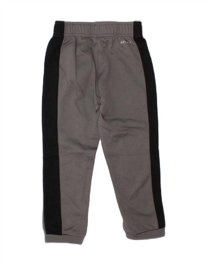 NIKE Boys Dri Fit Tracksuit Trousers Joggers 4-5 Years   Small Grey Vintage Nike and Second-Hand Nike from Messina Hembry 