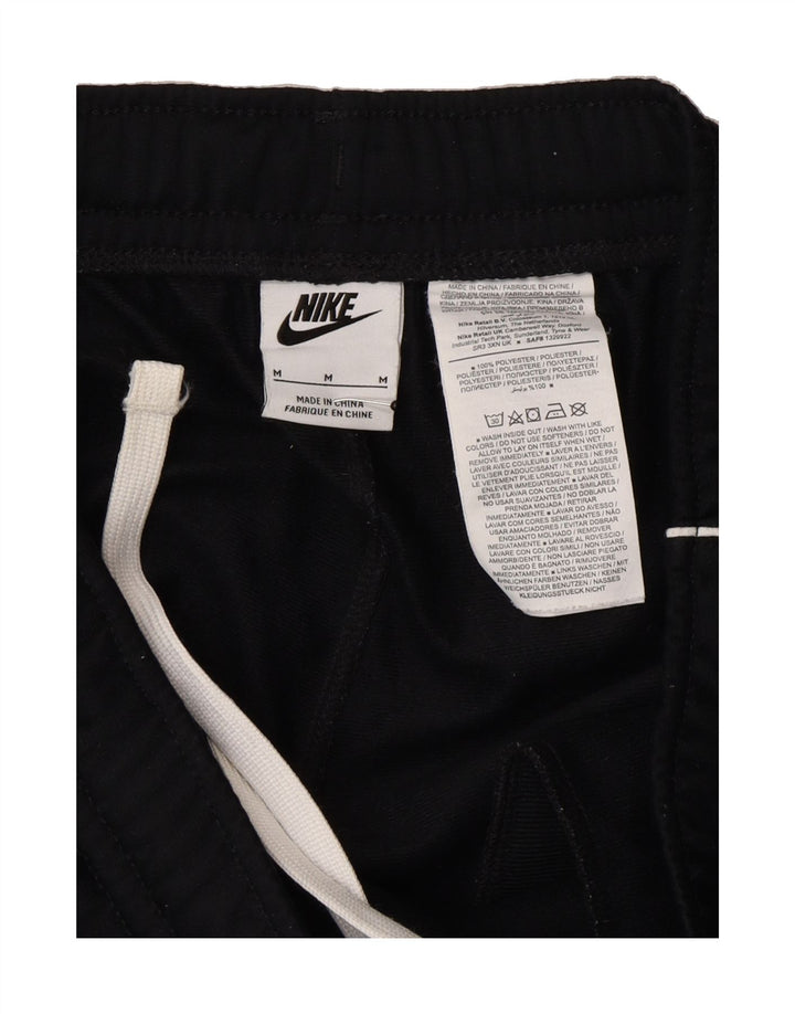 NIKE Mens Tracksuit Trousers Joggers Medium Black Polyester Vintage Nike and Second-Hand Nike from Messina Hembry 