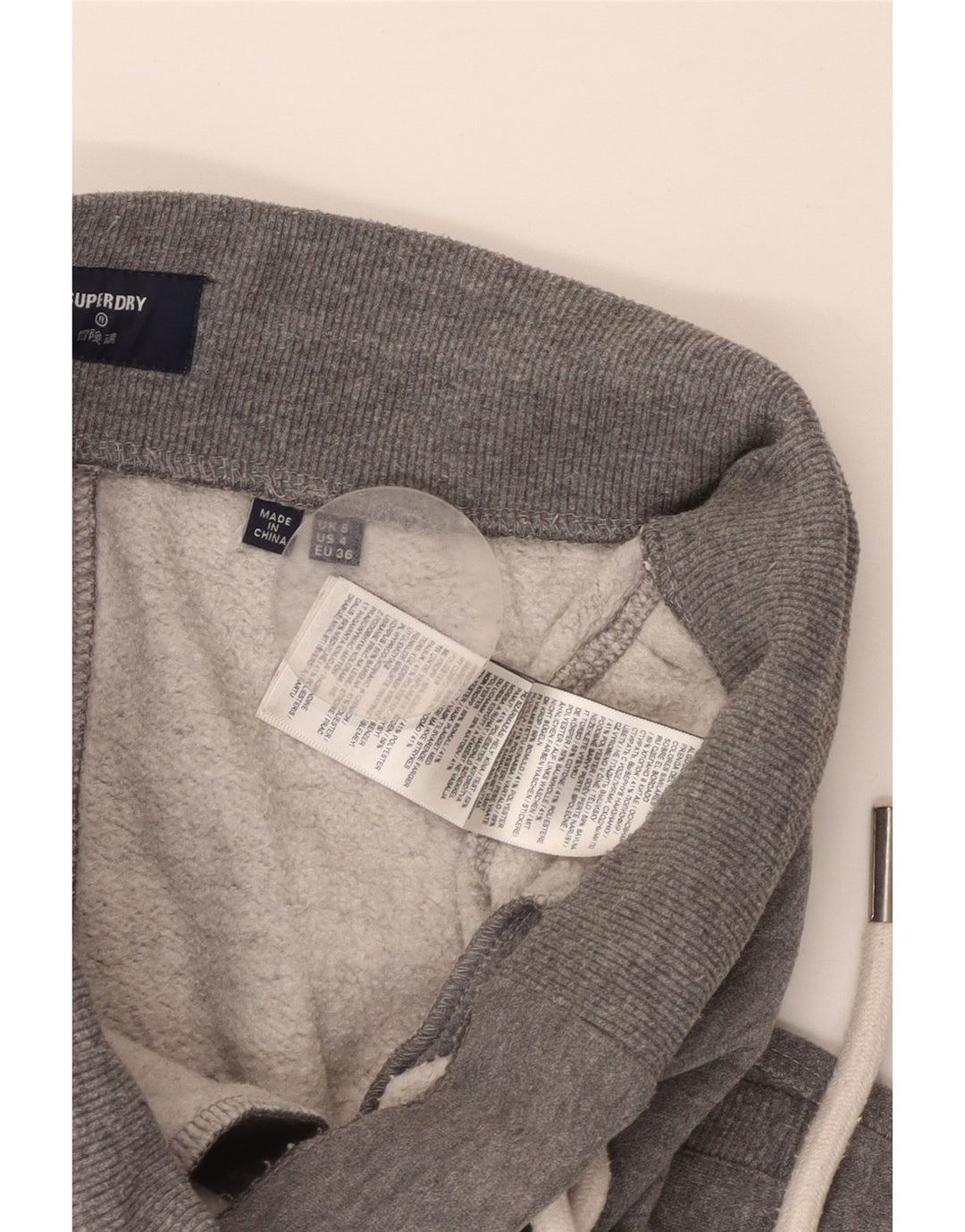 SUPERDRY grafiske træningsdragtbukser til kvinder, joggere UK 8 små grå flækkede