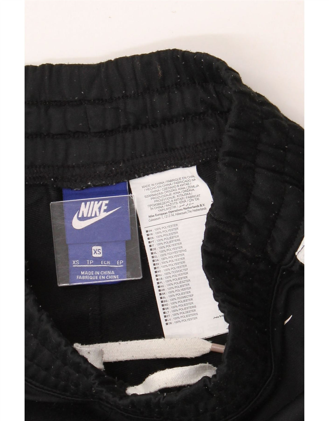 NIKE Mens Tracksuit Trousers XS Black Colourblock Polyester Vintage Nike and Second-Hand Nike from Messina Hembry 
