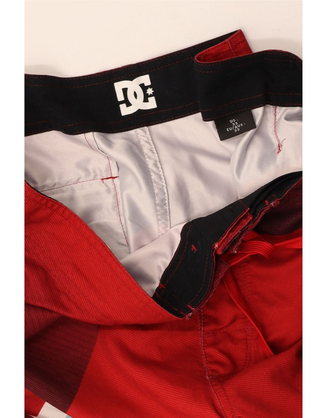 DC Grafiske svømmeshorts til mænd Medium rød farveblok