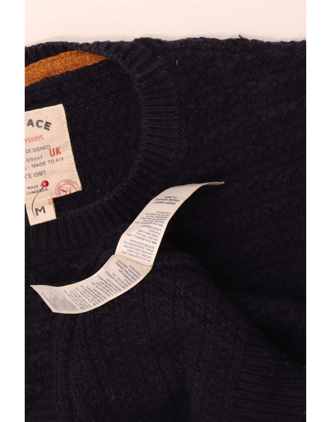 Fedt ansigt herre rund hals sweater mellem marineblå bomuld