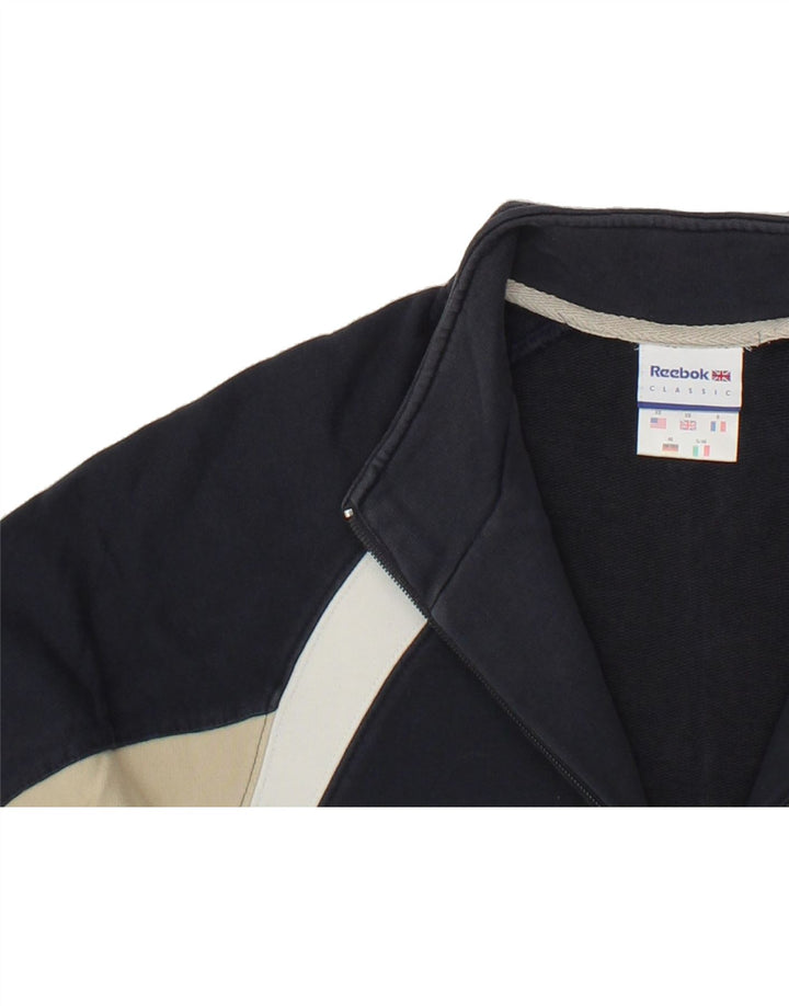 REEBOK Mens Tracksuit Top Jacket XS Navy Blue Colourblock Vintage Reebok and Second-Hand Reebok from Messina Hembry 