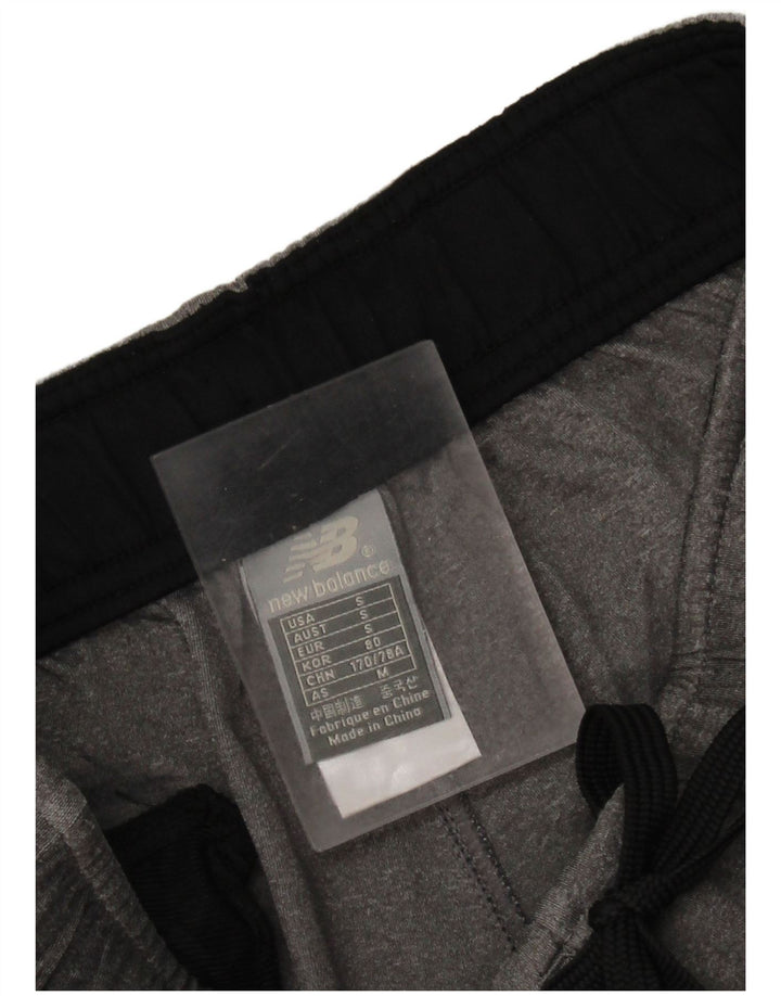 New Balance Træningsdragtsbukser til mænd Små grå polyester