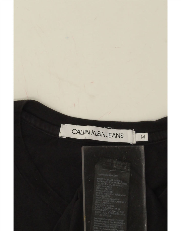 CALVIN KLEIN JEANS Mens Graphic T-Shirt Top Medium Black Cotton Vintage Calvin Klein Jeans and Second-Hand Calvin Klein Jeans from Messina Hembry 