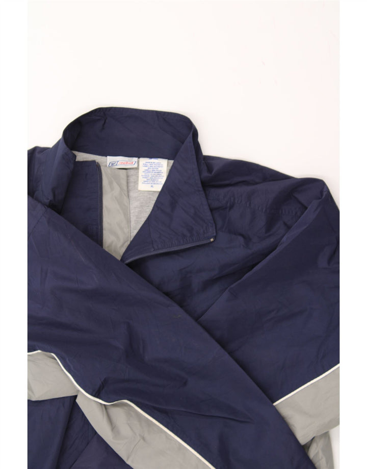 REEBOK Mens Tracksuit Top Jacket XL Navy Blue Colourblock Polyester Vintage Reebok and Second-Hand Reebok from Messina Hembry 