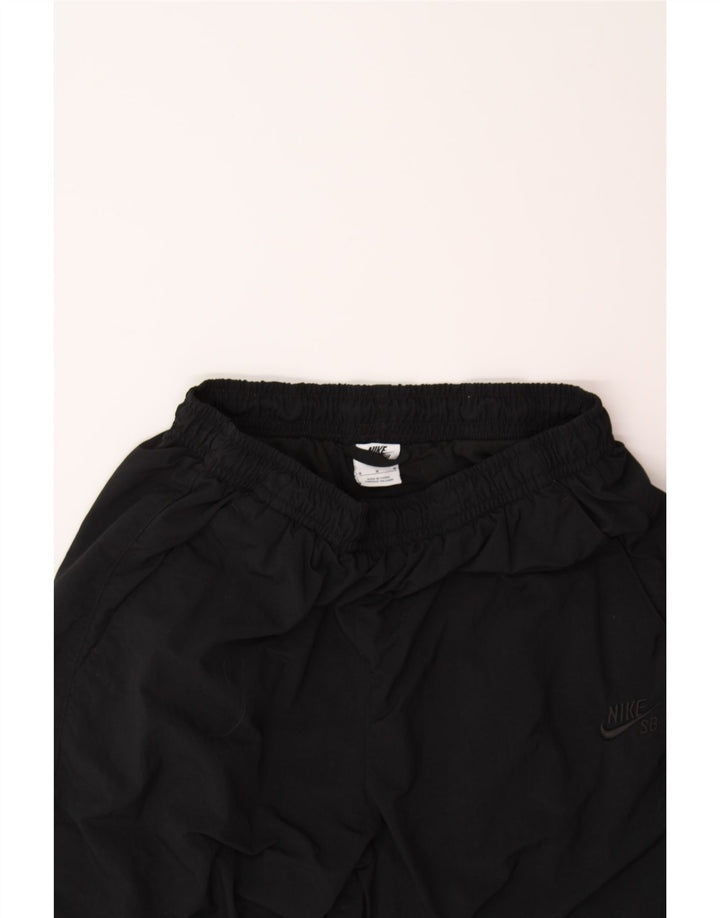 NIKE Womens Tracksuit Trousers Joggers UK 12 Medium  Black Nylon Vintage Nike and Second-Hand Nike from Messina Hembry 